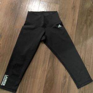 Adidas capris with Laurier University on the leg